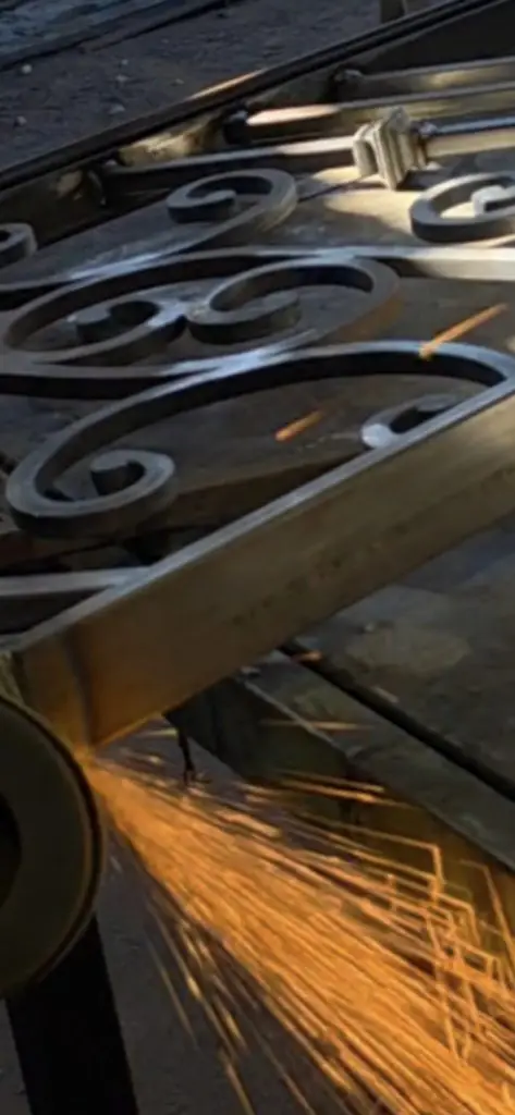 measuring an iron railing during a safety inspection for insurance review in Los Angeles